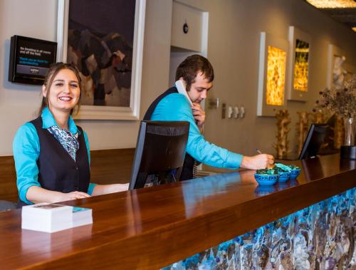 a man and a woman sitting at a bar at Han Hotel Istanbul in Istanbul