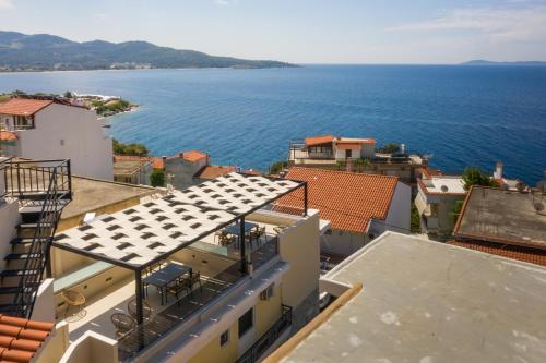 a view of the ocean from the roofs of buildings at SithoniaRS Boho Edition Luxury Roofgarden II in Neos Marmaras