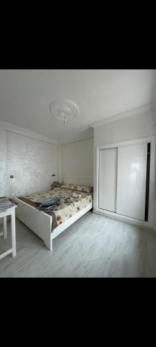a bedroom with a large bed in a room at Mini villa al hoceima in Al Hoceïma