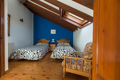A bed or beds in a room at Apartamentos Rurales Playa del Canal
