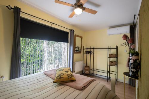 a bedroom with a bed with a large window at Studio Unique in Enschede