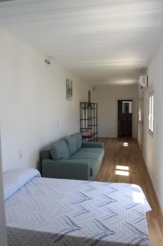 a living room with a couch and a bed at Siorica AG Low Cost in Matalascañas