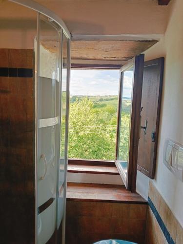 a bathroom with a shower and a window at Casa di Ruggi in Tenaglie