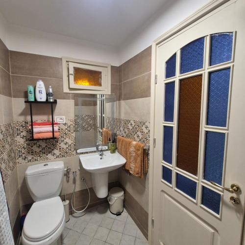 a bathroom with a toilet and a sink at dar Beya in Kairouan
