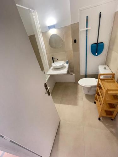 a bathroom with a toilet and a sink at Aparthotel New Palmarium in Amélie-les-Bains-Palalda