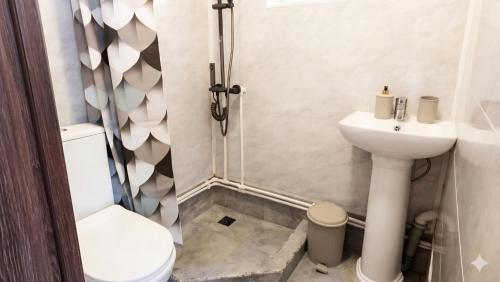 a bathroom with a toilet and a sink at Tsovazard Lake House in Tsovazard