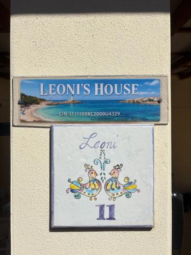 a sign for a leons house on a wall at Leoni's House in Calasetta