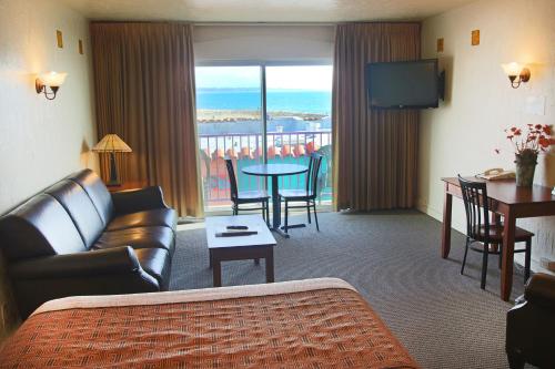 a living room with a couch and a table at Capitola Venetian Vacation Rentals in Capitola