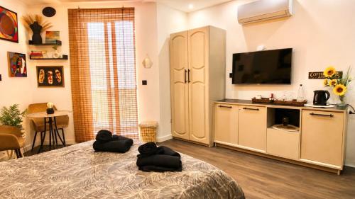 a bedroom with two dogs laying on a bed at D'Arte Suite in Tal-Liedna