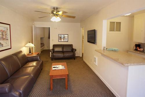 a living room with a couch and a table at Capitola Venetian Vacation Rentals in Capitola