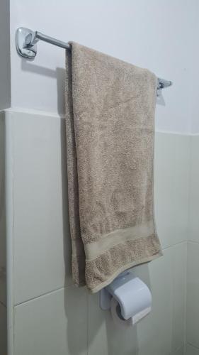 a towel hanging on a towel rack in a bathroom at appart near the Airport and beach tanger in Tangier