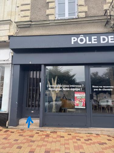 a police department store with a dog in the window at "Le Cocon Douessin" en hyper centre ! in Doué-la-Fontaine