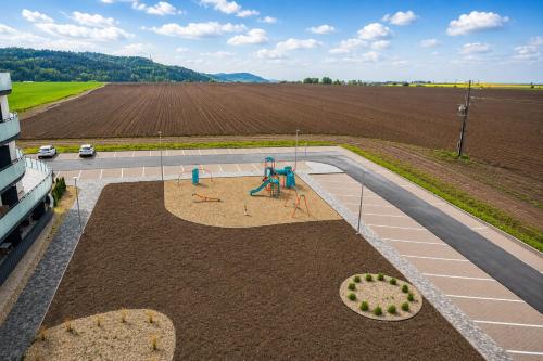 an aerial view of a playground next to a field at TRITA SK - Belanka in Spišská Belá