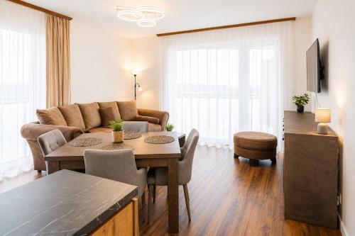 a living room with a couch and a table at TRITA SK - Belanka in Spišská Belá