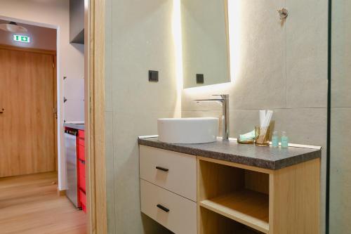 a bathroom with a sink and a counter at Olympia 3 in Xanthi