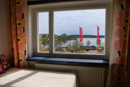 a window with a view of a body of water at Saimaa Design, lake view, AC, Wifi in Savonlinna
