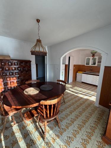 a room with a table and chairs and a kitchen at Nice postion, belle vue in Pučišća