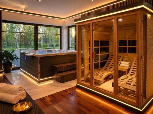 a room with a jacuzzi tub in a house at Argentum Private Residence Basen Sauna Jacuzzi in Koszelówka