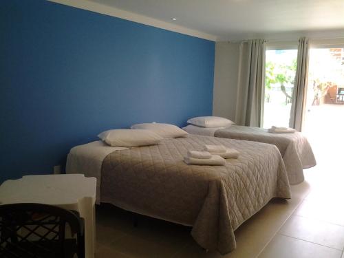 Ένα ή περισσότερα κρεβάτια σε δωμάτιο στο Costa Allegra Ingleses Residence