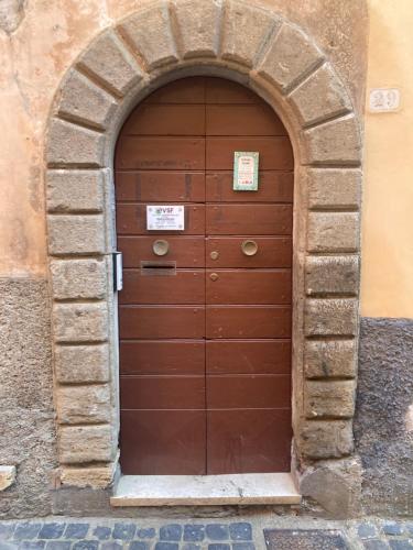 a large wooden door in a stone archway at Sophie`s Home in Gallese