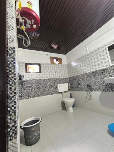 a bathroom with a toilet and a sink at Zen Homestay in Dirang Dzong