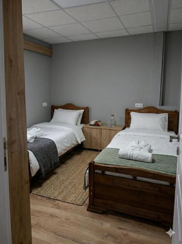 two beds in a room with two beds sidx sidx sidx sidx at Bluebell Cottage in Tsalka