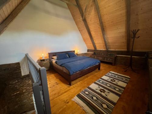 a bedroom with a bed and a wooden ceiling at Archita 155 in Archita