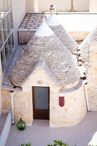 a model of a building with a door at Trullo Màufra in Locorotondo