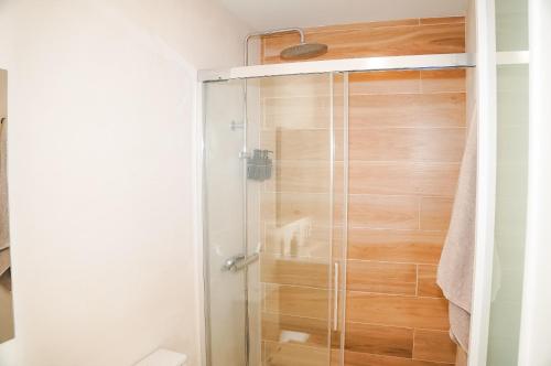a shower with a glass door in a bathroom at Casa Ines in Playa Honda