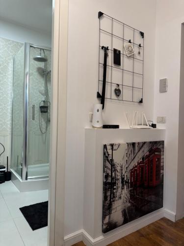 a fireplace in a bathroom with a shower at Dare apartments 3 in Giurgiu