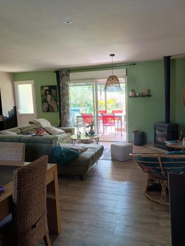 a living room with a person laying on a couch at Gite du gachou in Souillac