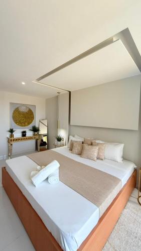 a bedroom with a large bed in a room at Vista Mar Suites in Praia