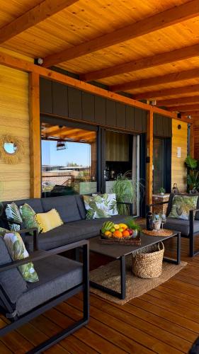 a living room with a couch and a table at Sunset Coast - Paradise Cottage in Drage