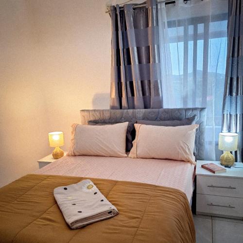 a bedroom with a bed with a pillow on it at OasisBhmz in Ponta do Ouro