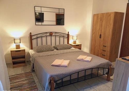 a bedroom with a bed with two towels on it at Villa Abelia in Medulin