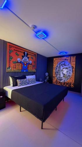a bedroom with a large bed with purple lights at Luxury Condo at Live Jaco Tower in Jacó