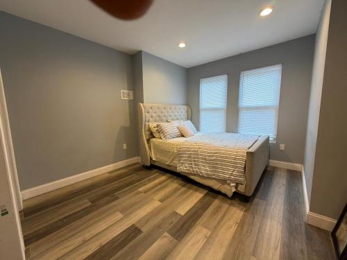 a bedroom with a bed and a window at Ben house in Baltimore