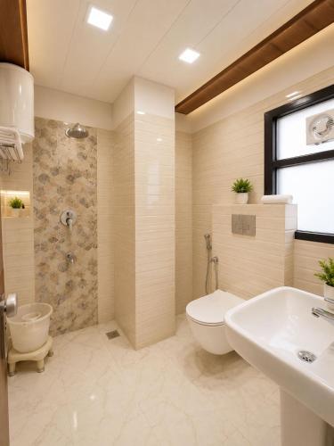 a bathroom with a toilet and a shower and a sink at Hotel Bellamontan Suites Near Delhi Airport - Free Airport Pickup & Drop in New Delhi