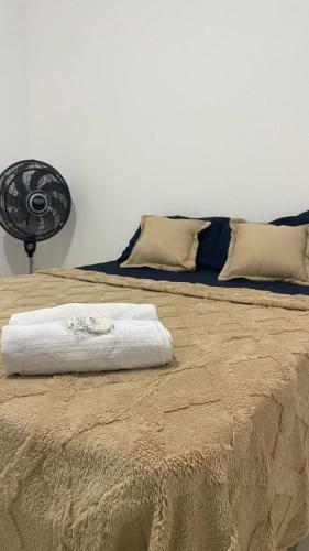 two beds sitting next to each other in a room at Villa Serrinha - Sitio Paraiso in Serrinha