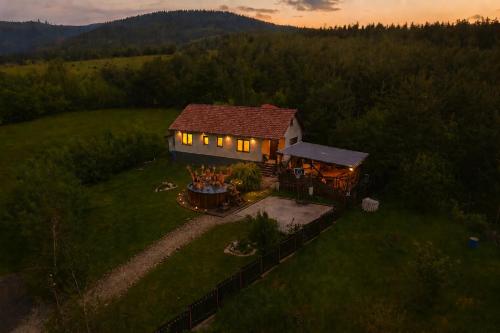 an aerial view of a house in a field at Bellevue Beam House in Covasna
