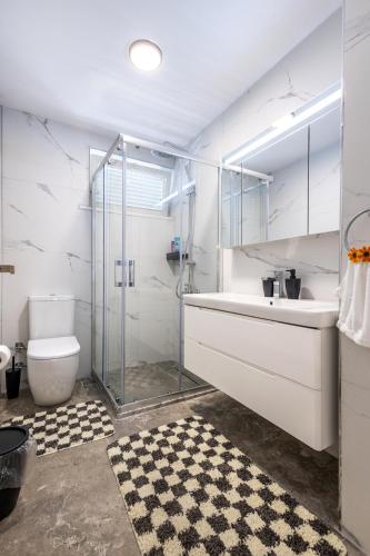 a bathroom with a shower and a sink and a toilet at 7a old Marmaris house in Marmaris