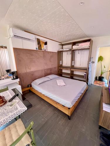 a bedroom with a large bed in a room at Beus home in Durrës