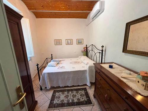 a bedroom with a bed and a dresser in it at Le Balze in Capannori