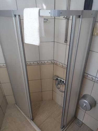a small bathroom with a shower with a toilet at Canna Garden Hotel - Adult Only in Gümbet