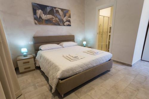 a bedroom with a bed with two towels on it at Antica Dimora Ceri in Ceri