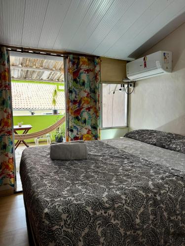 a bedroom with a bed and a view of a tennis court at Hostel New Ipanema in Rio de Janeiro