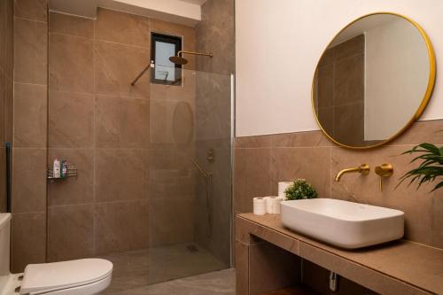 a bathroom with a sink and a mirror and a shower at V36A Horizon in Haad Yao