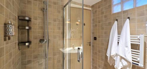 a bathroom with a shower and a sink at Ostrea - Lagune de Oualidia in Oualidia