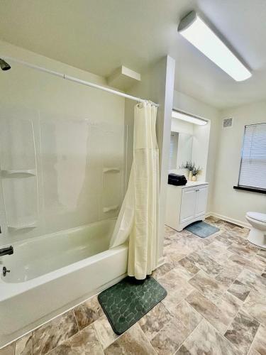 a bathroom with a shower and a toilet at Newly Renovated Quiant 2-bed 2-bath Apt in Wilmington