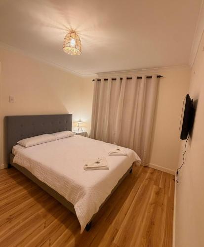 a bedroom with a bed and a television in it at Fleur de Collie in Collie